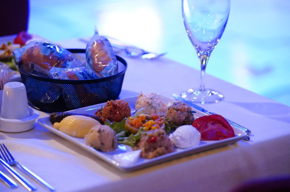 Istanbul: Dinner Cruise and Entertainment with Private Table - Dinner on Board: Turkish Meze, Your Main Choice, and Baklava
